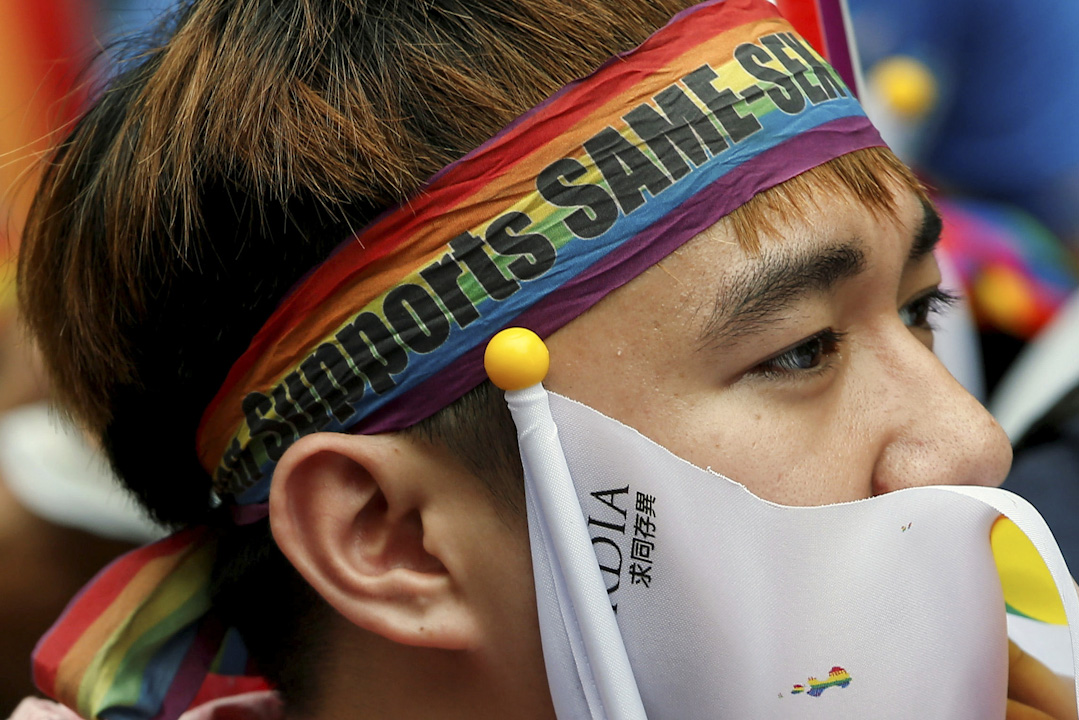 A supporter reacts during a rally after Taiwan's constitutional court ruled that same-sex couples have the right to legally marry, the first such ruling in Asia, in Taipei